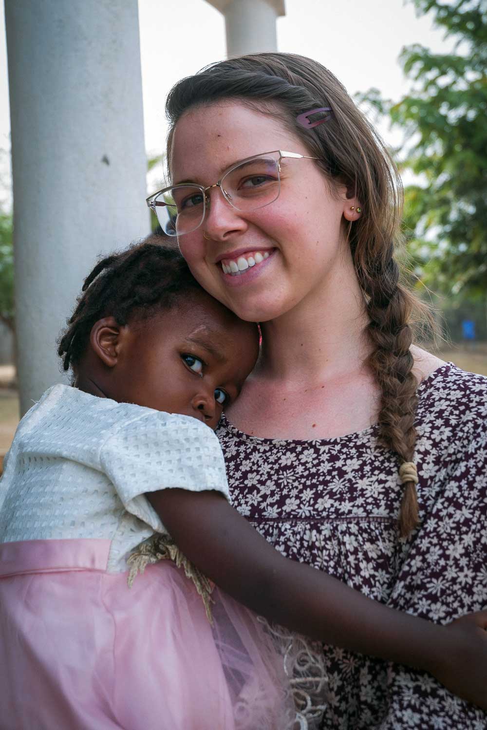 missionary holding a child