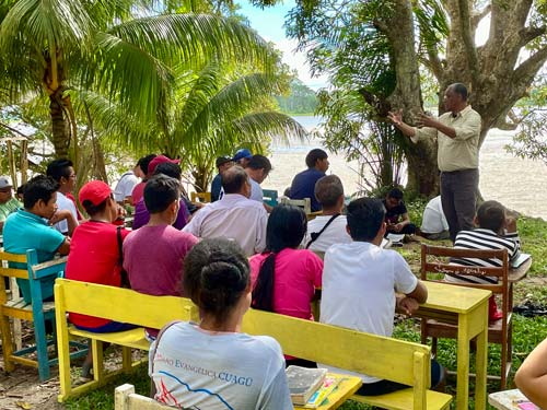group of young men receiving Bible training