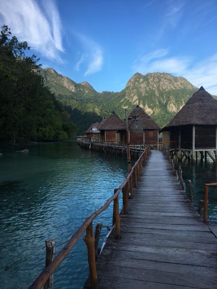 small huts on the water